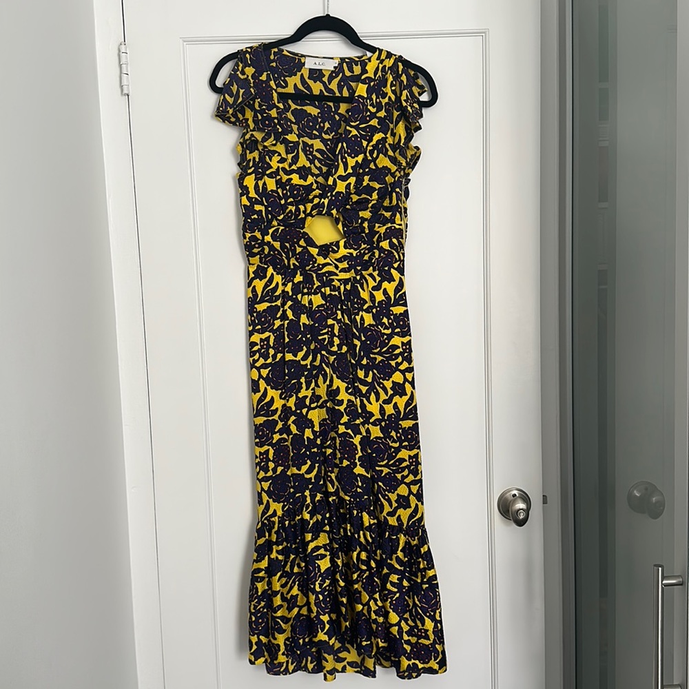Silk dress with peephole and ruffle details